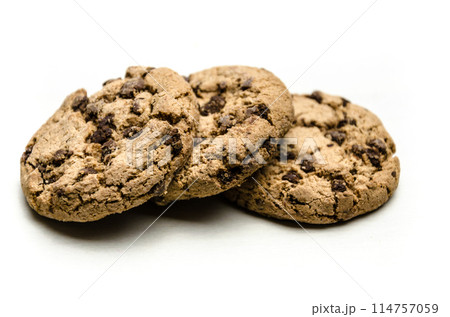 Close-up of homemade chocolate chip cookies isolated on white background. Close-up of homemade chocolate chip cookies isolated on white background. 114757059