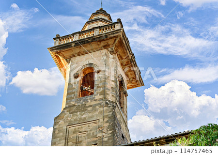 View of the bell tower of the San Bartolome church at dusk, from the picturesque village of Valldemosa, Mallorca, Balearic Islands, Spain 114757465