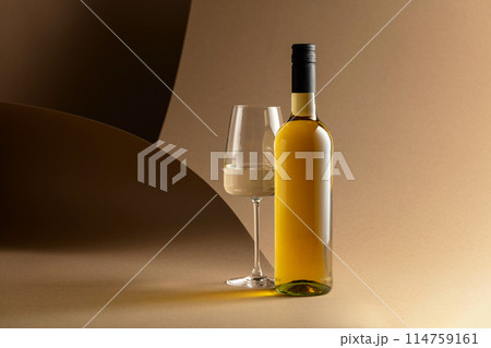 Bottle and glass of white wine. 114759161