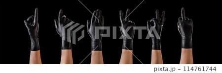 Hands in black gloves showing different gestures, pointing and showing signs Hands in black gloves showing different gestures, pointing and showing signs 114761744