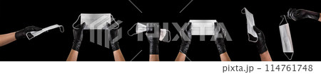 Hand in black gloves wearing disposable face mask isolated on black background 114761748