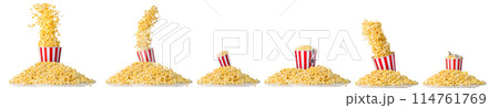 Paper striped bucket and 3D glasses on a heap of popcorn isolated on white 114761769