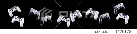 Set of video game joysticks gamepad isolated on a black background Set of video game joysticks gamepad isolated on a black background 114761780
