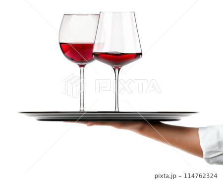 Waiter hand holding metal tray with set of red wine glasses isolated on white background 114762324