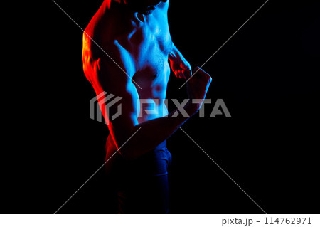 Portrait of man, bodybuilder and bicep flex in studio, background and exercise for muscular power. Portrait of man, bodybuilder and bicep flex in studio, background and exercise for muscular power. 114762971