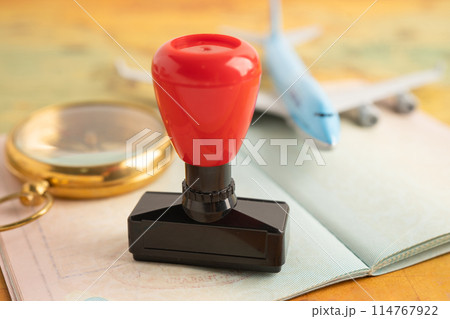 Approved Stamp visa and passport document to immigration at airport in country. 114767922
