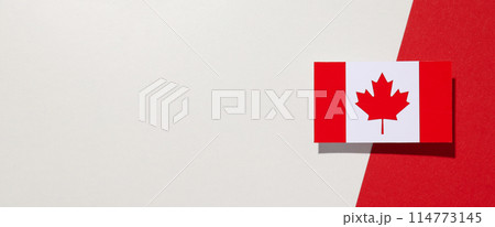 The flag of Canada on a white-red background 114773145
