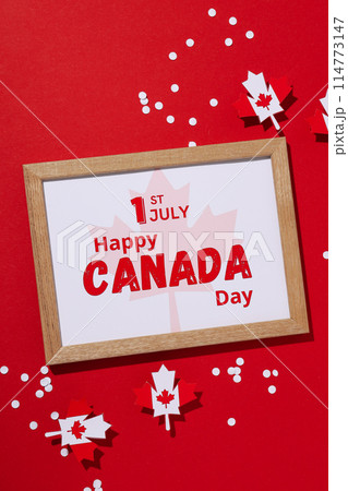 Holiday card for Canada Day on a red background Holiday card for Canada Day on a red background 114773147