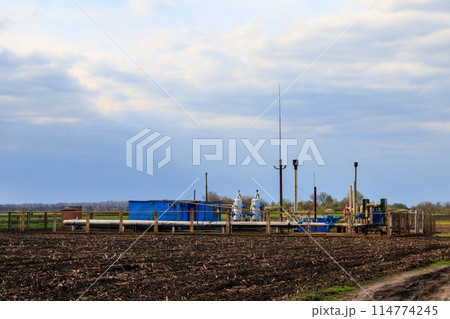 Distribution center for natural gas shipping and delivery. Gas pipeline station in field Distribution center for natural gas shipping and delivery. Gas pipeline station in field 114774245
