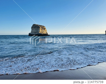 Beautiful seascape with beach, cliffs and ocean. Ferragudo, Portugal 114775739