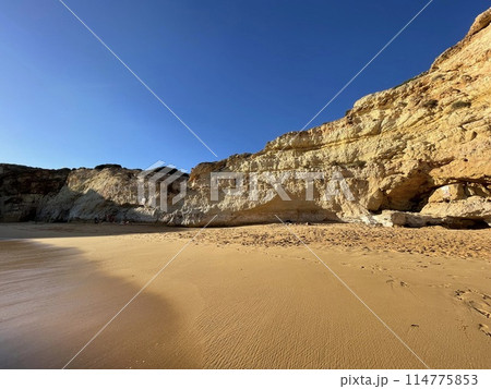 Beautiful seascape with beach, cliffs and ocean. Ferragudo, Portugal 114775853