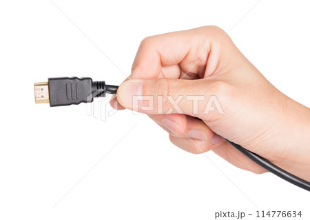 closeup hand holding HDMI plug 114776634