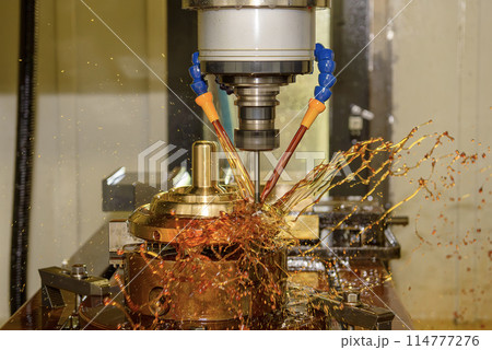The CNC milling machine cutting the shell mold parts with oil coolant method . 114777276
