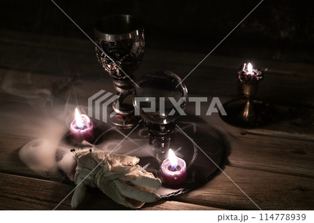 Mysterious Occult Ritual Setup with Crystal Ball and Candles. Mysterious Occult Ritual Setup with Crystal Ball and Candles. 114778939