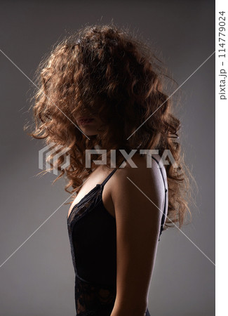 Beautiful Woman with curly Hair. Hairy Female silhouette 114779024
