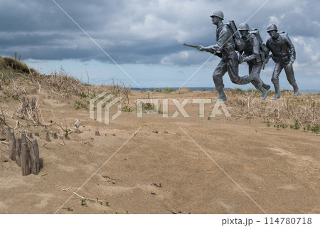 Normandy France D-Day soldiers sculptures photomontage at WWII Utah Beach. Veterans Day rememberance. High quality photomontage 114780718