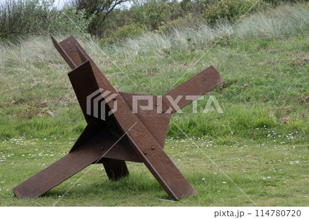 Normandy France D-Day soldiers sculptures and hedgehogs near WWII Utah Beach. Veterans Day rememberance. High quality photomontage Normandy France D-Day soldiers sculptures and hedgehogs near WWII Utah Beach. Veterans Day rememberance. High quality photomontage 114780720