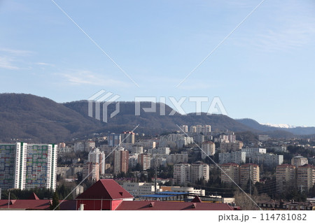 Beautiful view of residential buildings of a green resort at sunset high in the mountains in Sochi 114781082