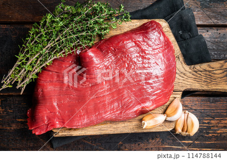 Alternative flank beef steak, raw meat. Wooden background. Top view 114788144