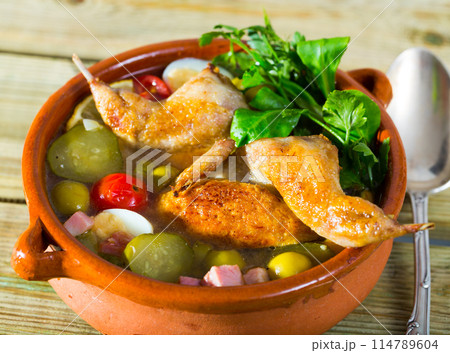 Solyanka with quail, ham, pickled cucumbers 114789604
