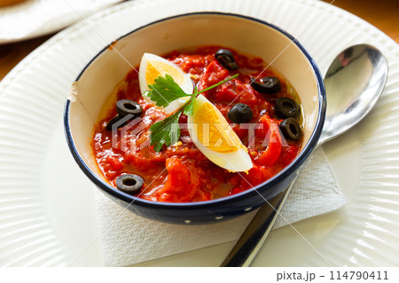 Salad of baked sweet peppers with boiled egg and olives Salad of baked sweet peppers with boiled egg and olives 114790411