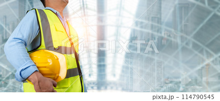 Civil engineer architect standing holding a safety helmet on construction site background, Construction site plans to build high-rise buildings, Engineer building concept, Background for construction. 114790545