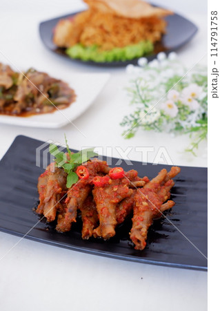 delicious spicy chicken feet as a background 114791758
