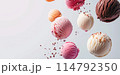 balls of different ice cream floating in the air on light background 114792350