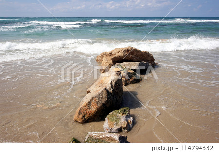 The coast of Caesarea Maritima on the Mediterranean Sea, Israel 114794332
