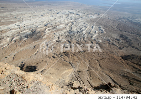 Waterless landscape of the Judea desert, view from Masada towards the Dead Sea, Israel Waterless landscape of the Judea desert, view from Masada towards the Dead Sea, Israel 114794342