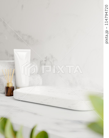 A space for showcasing products on a white marble tray on a white marble bathroom countertop. 114794720