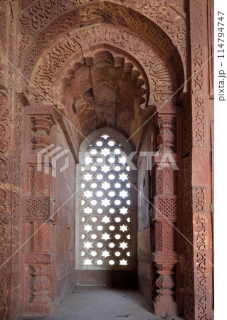 Window with sunglow in Alai Minar, Qutub Minar complex, Delhi, India 114794747