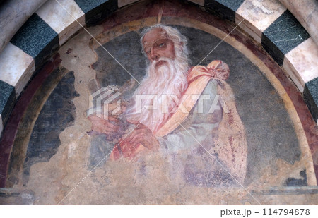 The lunette of one of the side doors depicting Aaron, detail of the facade of the Church of Santa Maria Novella in Florence, Italy 114794878