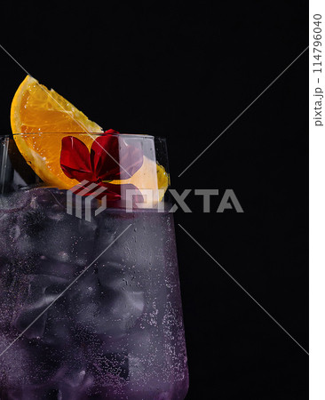 Elegant cocktail with purple tint and garnish 114796040