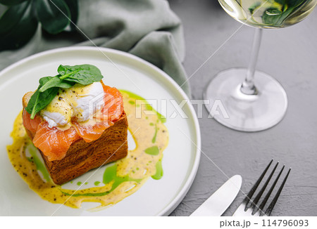 Gourmet smoked salmon toast with poached egg Gourmet smoked salmon toast with poached egg 114796093