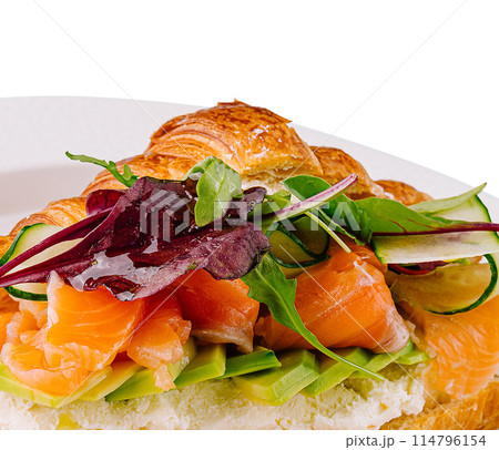 Gourmet smoked salmon croissant sandwich on white Gourmet smoked salmon croissant sandwich on white 114796154