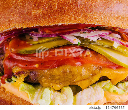 Delectable gourmet cheeseburger close up Delectable gourmet cheeseburger close up 114796585