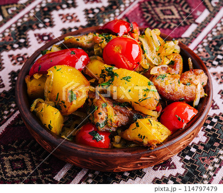 Traditional rustic potato and tomato dish 114797479