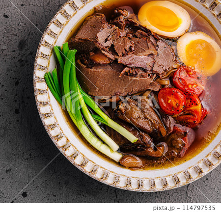 Savory beef ramen bowl with egg and vegetables Savory beef ramen bowl with egg and vegetables 114797535