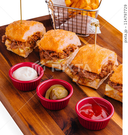 Tasty slider burgers with fries and dipping sauces 114797729