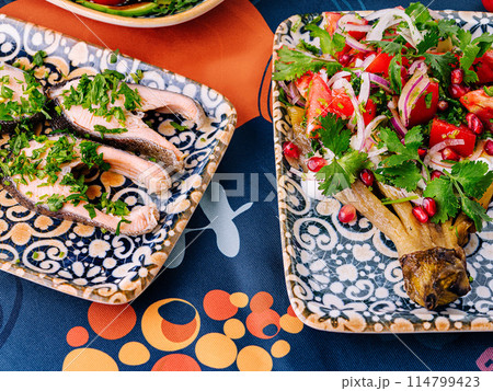 Vibrant mediterranean feast on colorful table setting 114799423