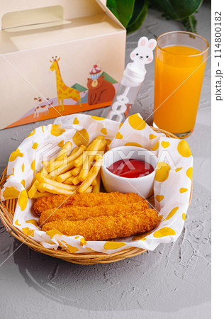 Kids meal with toy and juice on table 114800182