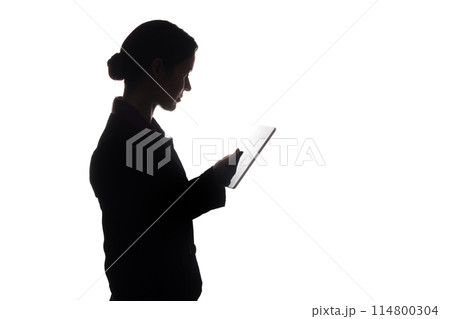 Young woman in suit shows pointer forward, side view - silhouette Young woman in suit shows pointer forward, side view - silhouette 114800304