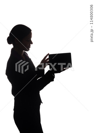 Young woman in suit shows pointer forward, side view - silhouette Young woman in suit shows pointer forward, side view - silhouette 114800306