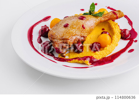 Gourmet duck confit with berry sauce 114800636