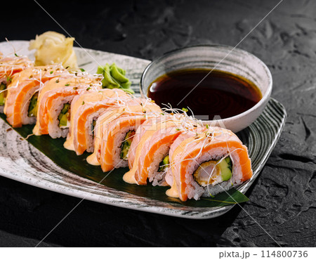 Fresh salmon sushi roll platter with dipping sauce 114800736