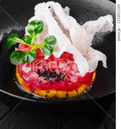 Exquisite gourmet tuna tartare with avocado and crispy bread 114801104