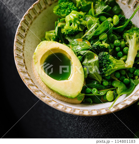Fresh green salad with avocado and seasonal vegetables Fresh green salad with avocado and seasonal vegetables 114801183