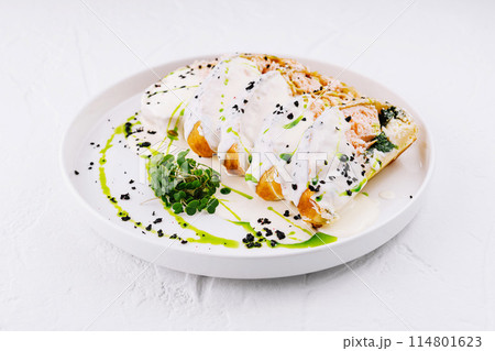 Gourmet stuffed chicken breast with cream sauce Gourmet stuffed chicken breast with cream sauce 114801623