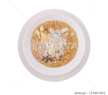 Almond and coconut porridge in white bowl Almond and coconut porridge in white bowl 114801803